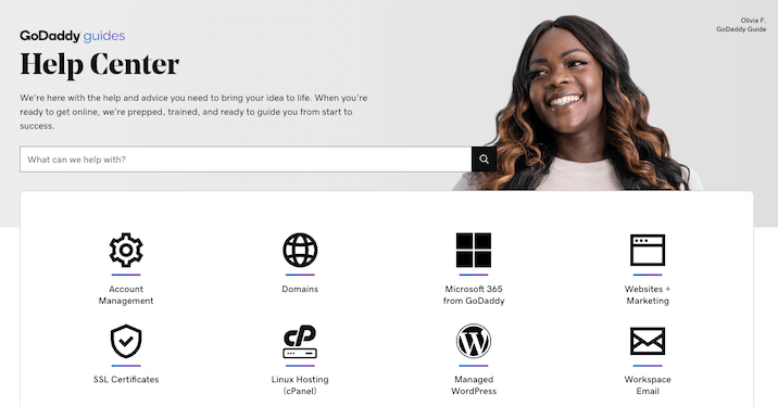 A screenshot from GoDaddy website of the help center with n image of a smiling woman.